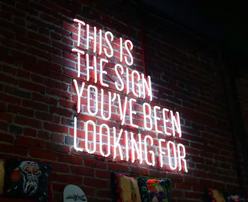 Neon sign with the text 'This is the sign you've been looking for'